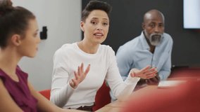 Team lead speaking and pointing in business meeting causing likes and comments multiplying. Conference, gesturing, engagement, collaboration, office, professional, modern - Powered by Shutterstock - Get 15% off with code: PIKWIZARD15