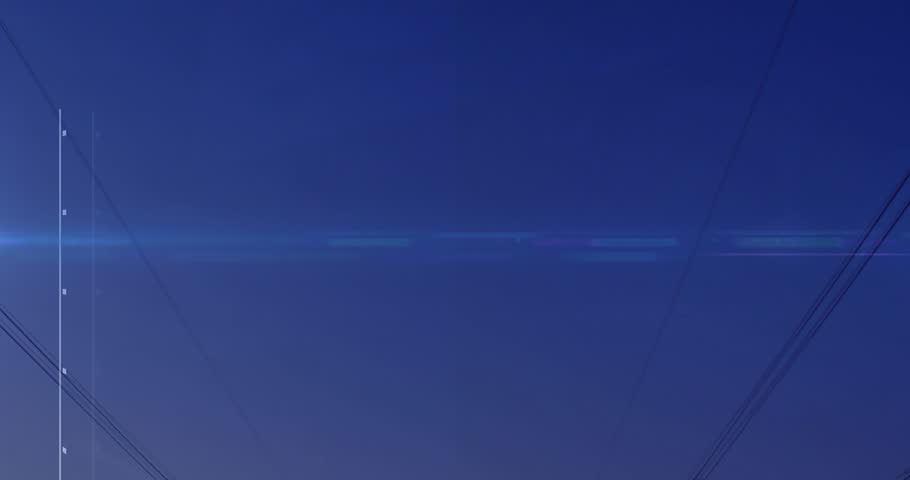 Lens flare moving left to right causing pylons and data graphs rising, showing energy trends. Transmission, towers, histogram, gridlines, skyline, twilight, visualization