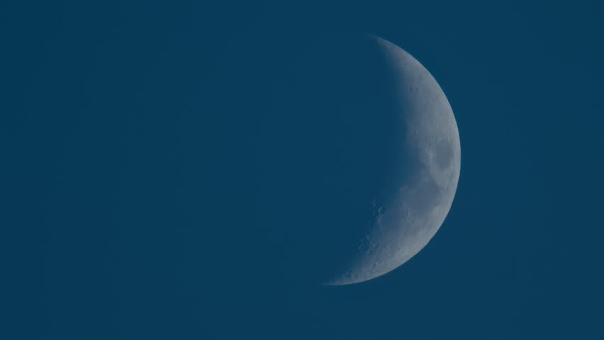 Close up of crescent moon illuminated against a deep blue sky