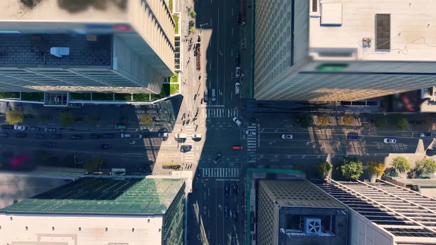 Aerial view of busy crossroads, building rooftops, skyscrapers in downtown Toronto, Ontario, Canada.