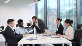 Angry boss scolds a group of subordinates for poor work results at a meeting in the boardroom. Dissatisfied manager quarreling incompetent workers. Furious CEO director arguing talking about problems - Powered by Shutterstock - Get 15% off with code: PIKWIZARD15