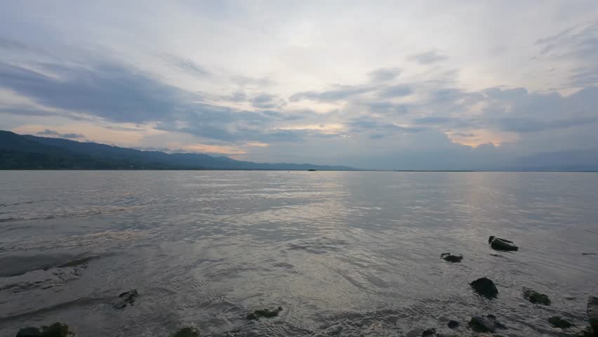 Cloudy Sky Over Lake in Evening. Slow motion