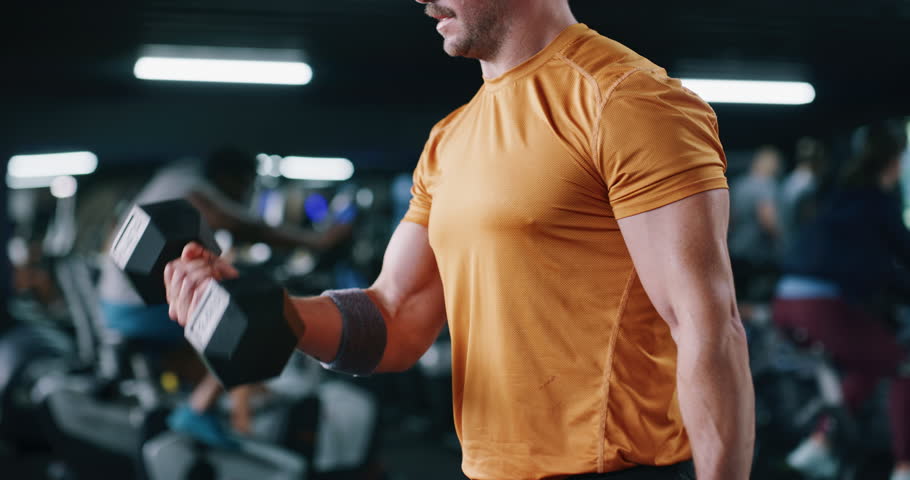 Dumbbell, exercise and hands of man in gym for strength training or workout routine. Effort, intensity and weightlifting with arms of bodybuilder in health club for fitness or physical challenge