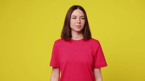 Fun fancy vivid smiling young woman she wear pink t-shirt casual clothes dance waving fooling around have fun enjoy play fluttering hair isolated on plain yellow background studio. Lifestyle concept - Powered by Shutterstock - Get 15% off with code: PIKWIZARD15