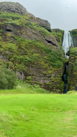 Hidden Waterfall Gljufrabui Between Mossy Cliffs Iceland Nature. High quality 4k footage