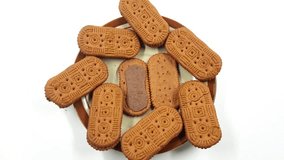 Biscuits with chocolate filling are arranged on a plate against a white background showcasing a delicious sweet snack perfect for dessert or a tasty treat representing indulgence and simple pleasures. - Powered by Shutterstock - Get 15% off with code: PIKWIZARD15