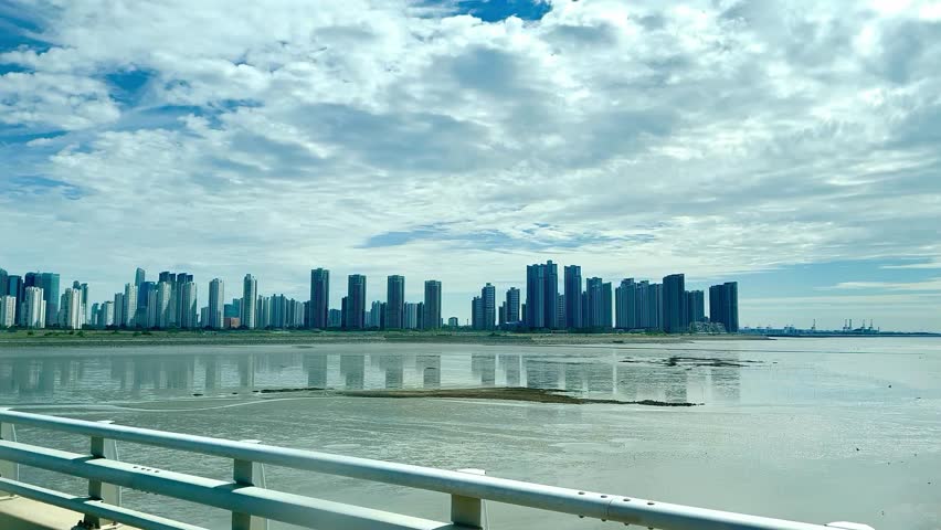 Panoramic Skyscraper Skyline from Highway Bridge Approaching Incheon Airport, South Korea 