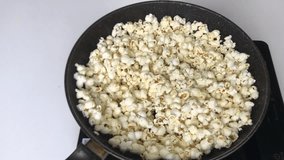 Popcorn explodes in the pan top view - Powered by Shutterstock - Get 15% off with code: PIKWIZARD15
