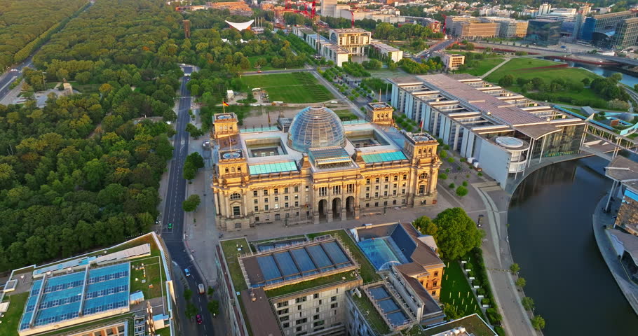 Aerial view of Reichstag in Berlin and Government Buildings and central park at sunrise, Germany