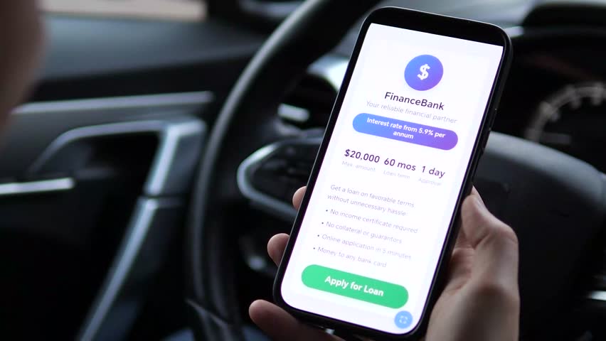 A potential borrower studies an ultra streamlined online credit offer directly from his smartphone. This scene captures the evolution of consumer finance towards minimal-friction processes.