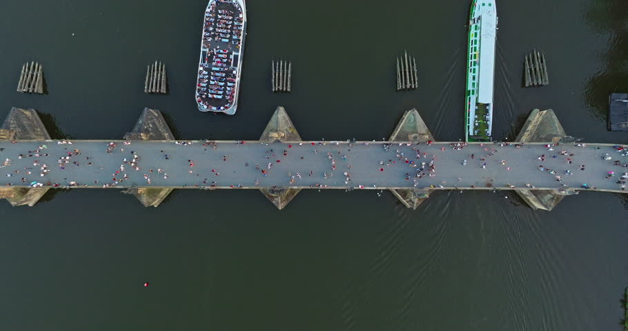 Aerial view of Prague Charles bridge and old town at sunset, over river. Czech Republic city Prague