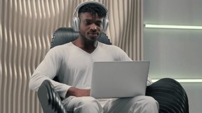 Emotional winner African American man male guy with laptop victory online win with pc in futuristic room indoors joyful programmer in wireless headphones with computer winning achieve hacker gaming - Powered by Shutterstock - Get 15% off with code: PIKWIZARD15