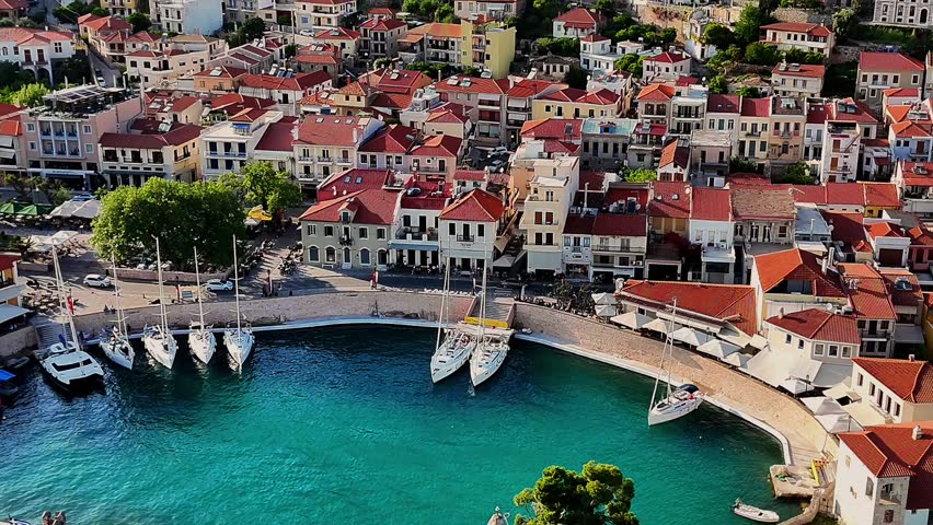 Aerial drone footage capturing the Venetian Harbour of Nafpaktos, Greece, with its iconic circular port, stone walls, and entrance towers. 