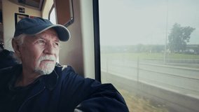 Old Man Watches Out of the Window as the Train Moves Travelling - Powered by Shutterstock - Get 15% off with code: PIKWIZARD15