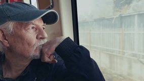 Old Man Watches Out of the Window as the Train Moves Travelling - Powered by Shutterstock - Get 15% off with code: PIKWIZARD15