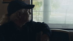 Old Man Watches Out of the Window as the Train Moves Travelling - Powered by Shutterstock - Get 15% off with code: PIKWIZARD15