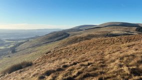 Panoramic landscape from hillwalking path in Glendevon hills, Scotland featuring moorland slopes, distant reservoirs, bare trees, and wide open terrain under cold winter skies. - Powered by Shutterstock - Get 15% off with code: PIKWIZARD15