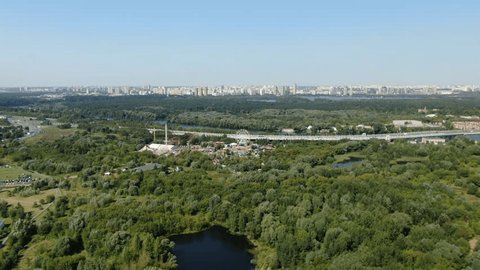 Drone Descending Over Ferris Wheel at Skazka Amusement Park, Moscow