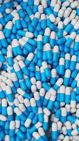 White and blue pills mixing and spin in slow motion. Drugs, pills, tablets, medicine concept. 3d render animation Vertical video. 3D Illustration