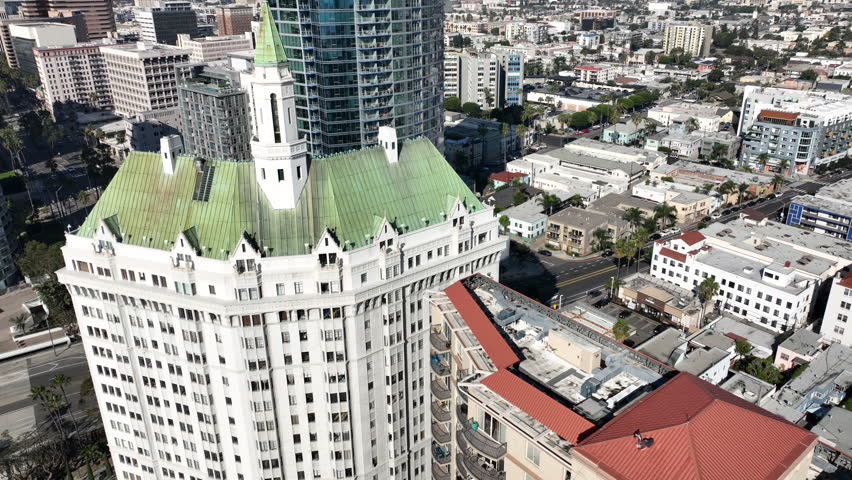 Long Beach, California, USA - Aerial View of Villa Riviera in Downtown Long Beach, CA on the Beach Path With Runners on Alamitos Beach With Luxury Apartments and Condos on Ocean Blvd 