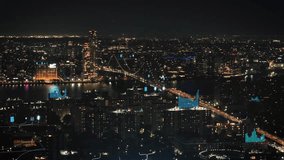 Dynamic digital overlays visualize data flow and network connections across a modern cityscape at night, representing a smart urban environment and technological advancement - Powered by Shutterstock - Get 15% off with code: PIKWIZARD15