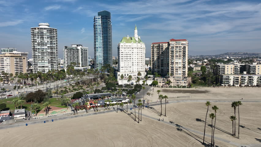 Long Beach, California, USA - Aerial View of Downtown Long Beach, CA on the Beach Path With Runners on Alamitos Beach With Luxury Apartments and Condos on Ocean Blvd 