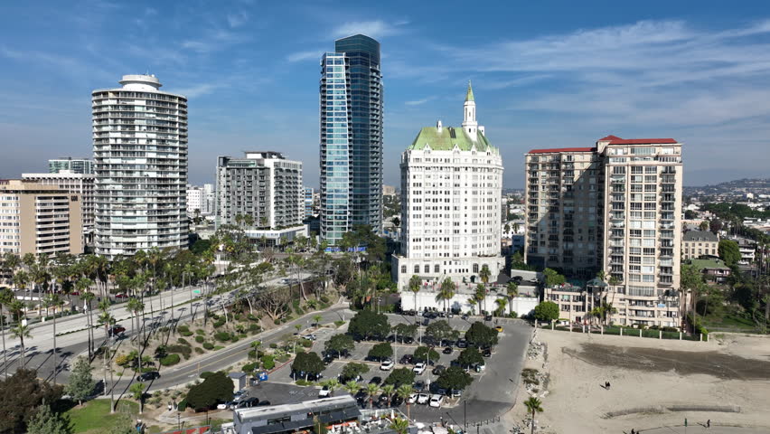 Long Beach, California, USA - Aerial View of Alamitos Beach on Ocean Blvd Circling Apartment Building and Condos in Shoreline Downtown Long Beach, CA