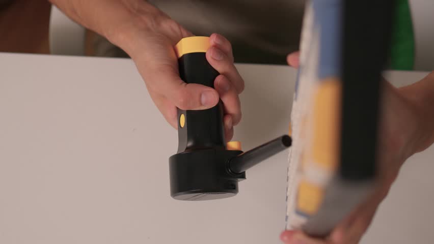 Closeup showing detailed cleaning of keyboard keys, Demonstration of meticulous keyboard cleaning involving dust removal and careful inspection in home environment