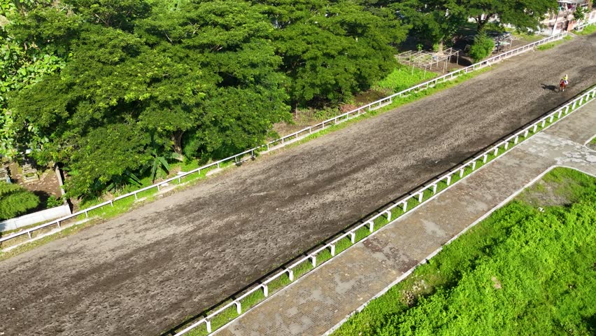 Rider enjoys horseback riding around the track at Sultan Agung Stadium in Bantul, Yogyakarta