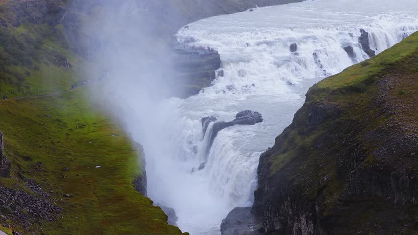 The spectacular aerial view of Gullfoss waterfall in Iceland. Water cascades over the rocks at Gulfoss Waterfall - one of the most popular waterfalls in Iceland. 