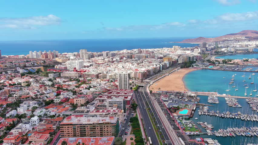 Las Palmas de Gran Canaria, Canary Islands, Spain: Aerial view of one of capital cities of Canary Islands, beach Playa de Las Alcaravaneras - landscape panorama of  Atlantic Ocean islands from above
