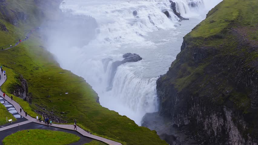 The spectacular aerial view of Gullfoss waterfall in Iceland. Water cascades over the rocks at Gulfoss Waterfall - one of the most popular waterfalls in Iceland. 
