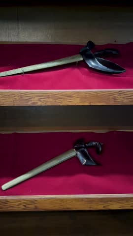 traditional keris equipment displayed on shelves