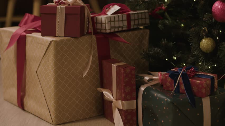 A detailed 4K view of a decorated Christmas tree, symbolizing the historic German 'paradise tree' tradition and gift-giving customs.