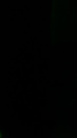 Abstract vertical light streaks overlay with neon glitch effects against a black background. High-energy motion graphic loop ideal for social media stories, TikTok, or VJ visuals.