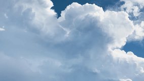 Dynamic cumulus and cumulonimbus clouds build and shift rapidly in bright daylight, timelapse sequence - Powered by Shutterstock - Get 15% off with code: PIKWIZARD15