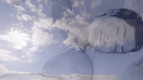 Sleeping person with clouds animation in peaceful setting. Dream, relaxation, tranquility, serenity, night, calm - Powered by Shutterstock - Get 15% off with code: PIKWIZARD15
