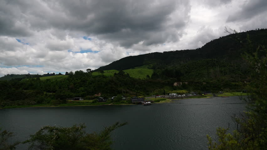 Storm clouds over lakeside hills in New Zealand
