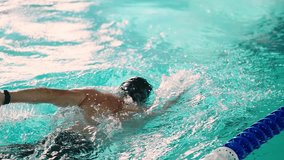 Dynamic and Engaging Swimming Technique Showcased in Two Stunning Frames Illustrating the Grace and Efficiency of a Swimmer in Action in a Pool Environment - Powered by Shutterstock - Get 15% off with code: PIKWIZARD15