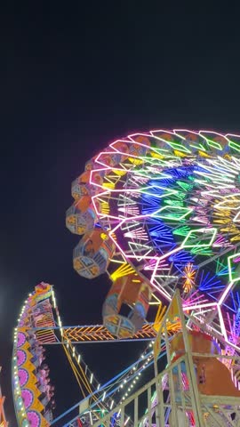 Video of Ferris Wheel or Joint wheel ride playing in night at fair ground during the annual fair.
