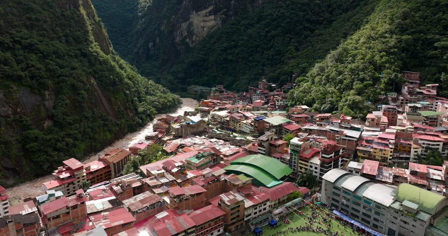 Aguas Calientes in Urubamba River Valley in deep gorge in Cusco region. Aerial