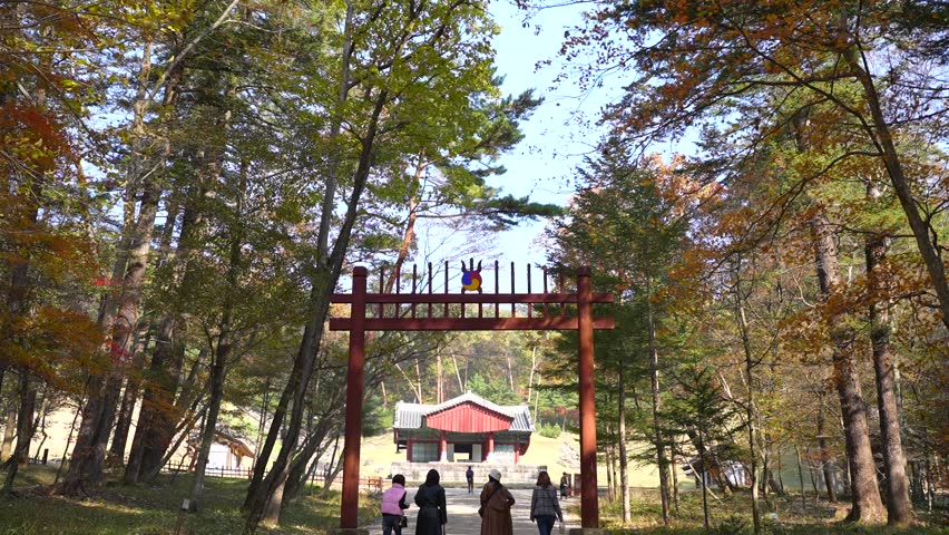 Gwangneung Royal Tomb (UNESCO World Heritage): Hongsalmun Gate and Jeongjagak Shrine in Autumn with Visitors.
