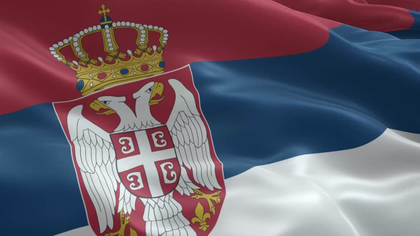 Patriotic Serbia flag waving in the breeze, a symbol of national pride and identity, evoking feelings of freedom and unity, great for news or travel footage