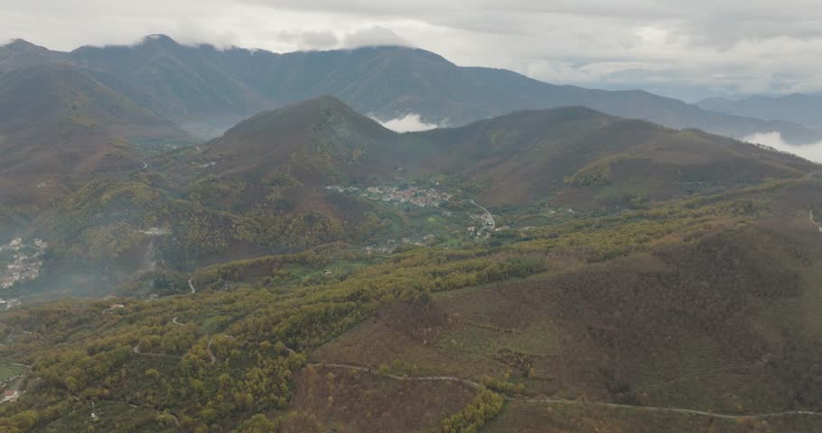 Aerial view of mountains and a town, Italy.