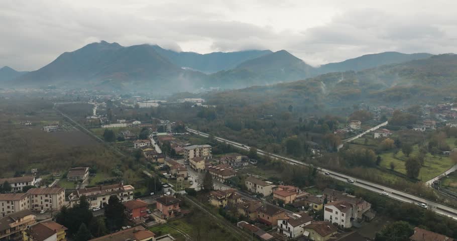 Aerial view of town near mountains, Italy.
