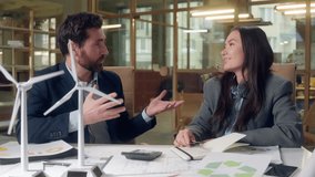 Business collaboration success joyful discussion recycling strategy Korean woman Caucasian man engineer laughing charts sustainable innovation eco planning green solution teamwork environmental growth - Powered by Shutterstock - Get 15% off with code: PIKWIZARD15