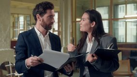 Multiethnic business team Korean excited businesswoman presenting colorful chart folder happy Caucasian businessman teamwork discussion strategy leader partners office report planning clipboard ideas - Powered by Shutterstock - Get 15% off with code: PIKWIZARD15