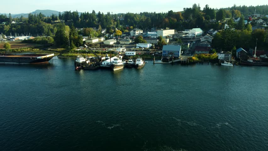 US, WA, Cathlamet, 2025-10-22 - Drone view of the docks, boats, and city on a fall morning