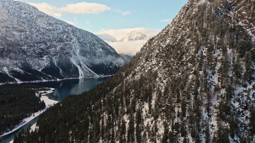 Aerial view of snowy mountains and lake, Austria.