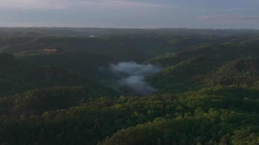 Calm morning view of mist over lush hills in Red River Gorge, Kentucky